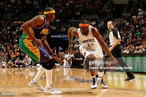 Ronald "Flip" Murray of the Charlotte Bobcats drives against James Posey of the New Orleans Hornets during the game on February 6, 2010 at the Time...