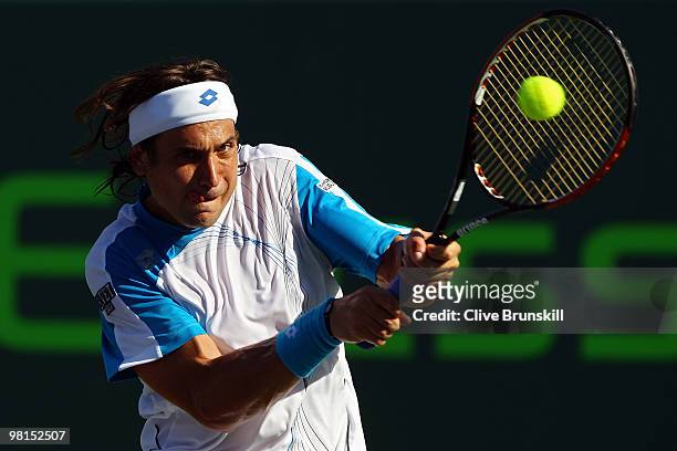 David Ferrer of Spain returns a shot against Rafael Nadal of Spain during day eight of the 2010 Sony Ericsson Open at Crandon Park Tennis Center on...