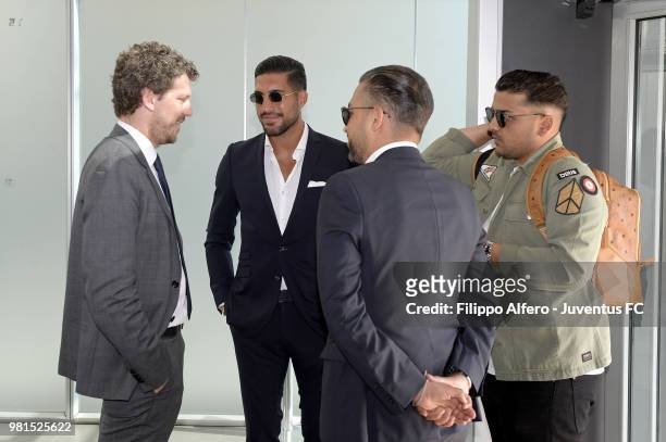New Juventus signing Emre Can is welcomed following his arrival in Turin on June 21, 2018 in Turin, Italy.