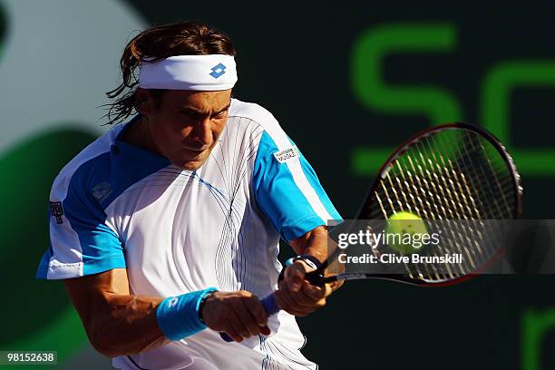 David Ferrer of Spain returns a shot against Rafael Nadal of Spain during day eight of the 2010 Sony Ericsson Open at Crandon Park Tennis Center on...