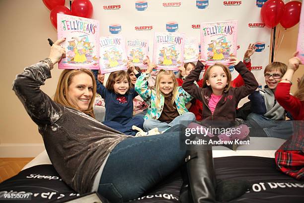 New York Times bestselling children's author Laura Numeroff poses with children holding her new book "The Jellybeans and the Big Book Bonanza" at the...