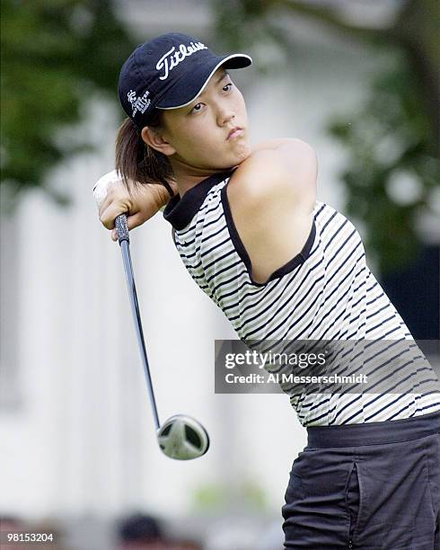 Michelle Wie, a 13-year-old amateur from Honolulu, follows her drive on the first tee at the Jamie Farr Kroger Classic August 11,2003 in Sylvania,...