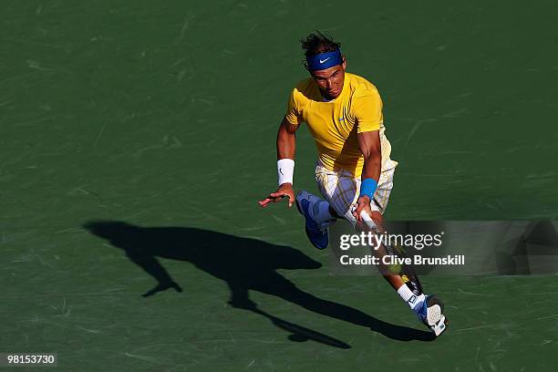 Rafael Nadal of Spain returns a shot against David Ferrer of Spain during day eight of the 2010 Sony Ericsson Open at Crandon Park Tennis Center on...