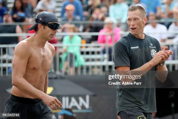 Casey Patterson and Stafford Slick celebrate while competing against Maddison McKibbin and Riley McKibbin during opening rounds of the AVP Seattle...