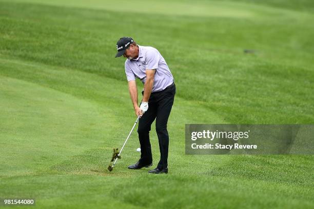 Jerry Kelly hits his second shot on the 18th hole during the first round of the American Family Insurance Championship at University Ridge Golf...