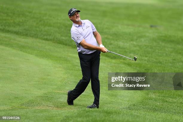 Jerry Kelly hits his second shot on the 18th hole during the first round of the American Family Insurance Championship at University Ridge Golf...