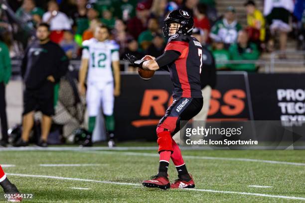 Ottawa RedBlacks quarterback Trevor Harris looks to makes a pass during Canadian Football League action between Saskatchewan Roughriders and Ottawa...