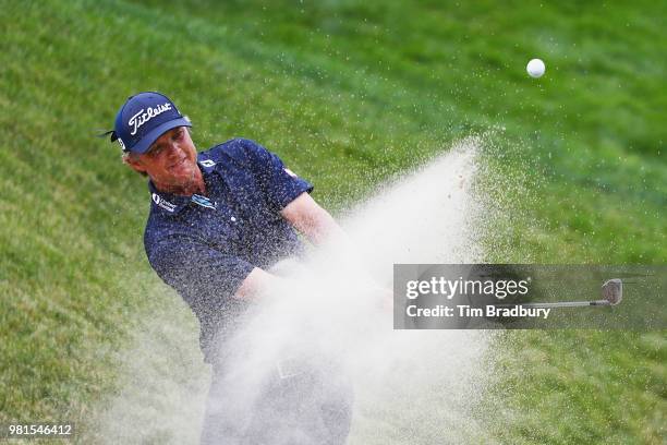 Matt Jones of Australia plays a shot from a greenside bunker on the 13th hole during the second round of the Travelers Championship at TPC River...