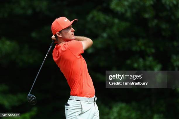 Russell Henley of the United States plays his shot from the 14th tee during the second round of the Travelers Championship at TPC River Highlands on...