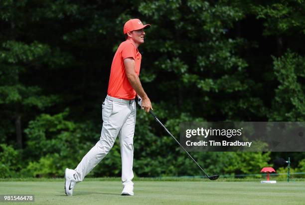 Russell Henley of the United States plays his shot from the 14th tee during the second round of the Travelers Championship at TPC River Highlands on...