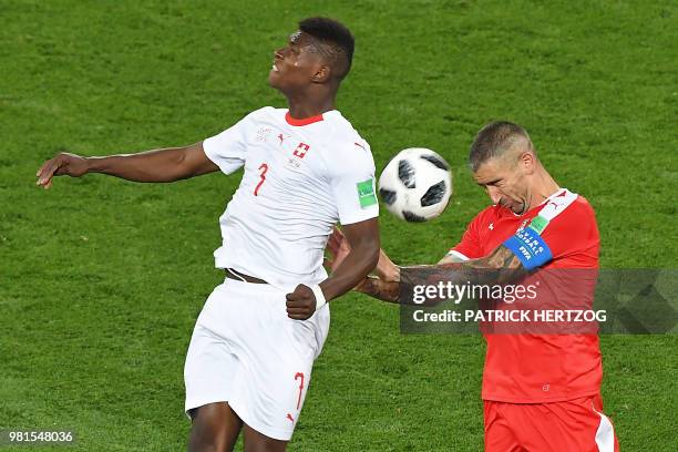 Switzerland's forward Breel Embolo vies for the ball with Serbia's defender Aleksandar Kolarov during the Russia 2018 World Cup Group E football...