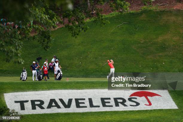 Russell Henley of the United States plays his shot from the 15th tee during the second round of the Travelers Championship at TPC River Highlands on...