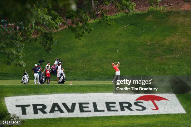 Russell Henley of the United States plays his shot from the 15th tee during the second round of the Travelers Championship at TPC River Highlands on...