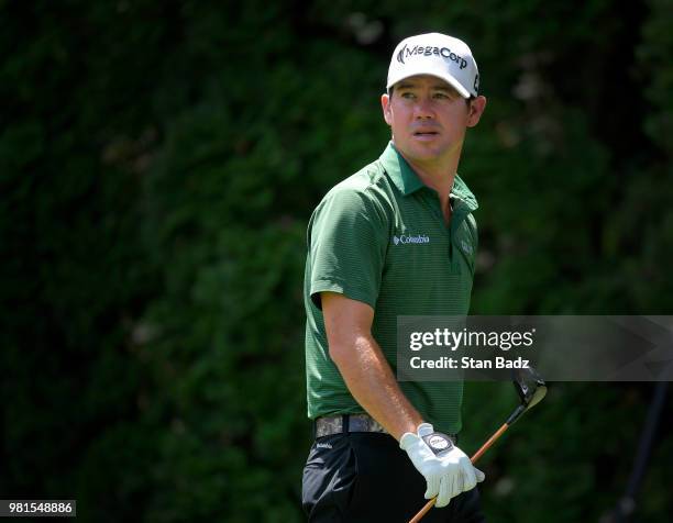 Brian Harman watches his tee shot on the ninth hole during the second round of the Travelers Championship at TPC River Highlands on June 22, 2018 in...