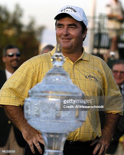 Craig Parry of Australia poses with the winner's trophy after the final round of the PGA Tour Ford Championship at Doral in Miami, Florida March 7,...