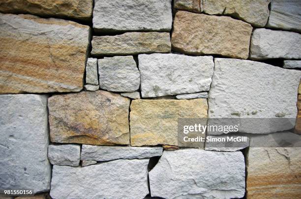 dry stone retaining wall - stone wall stock pictures, royalty-free photos & images