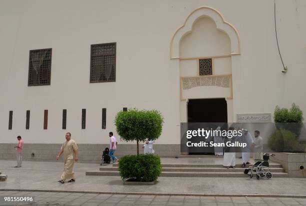 Men depart following Friday, midday prayers at the King Saud mosque on June 22, 2018 in Jeddah, Saudi Arabia. The Saudi government, under Crown...