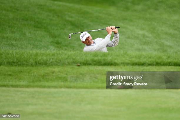 Fred Couples hits his approach shot on the 18th hole during the first round of the American Family Insurance Championship at University Ridge Golf...