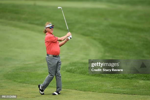 Miguel Angel Jimenez of Spain hits his approach shot on the 18th hole during the first round of the American Family Insurance Championship at...