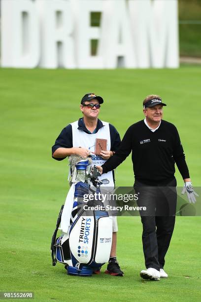 Paul Broadhurst of England pulls a club from his bag on the 18th hole during the first round of the American Family Insurance Championship at...