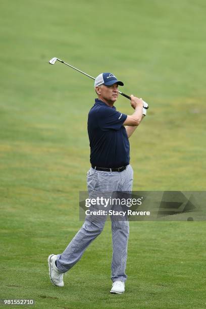 Davis Love III hits his approach shot on the 18th hole during the first round of the American Family Insurance Championship at University Ridge Golf...