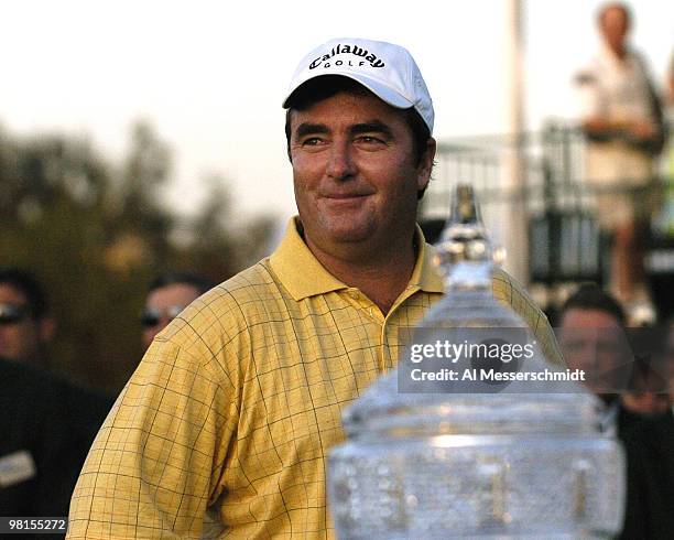 Craig Parry of Australia poses with the winner's trophy after the final round of the PGA Tour Ford Championship at Doral in Miami, Florida March 7,...