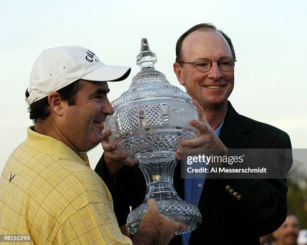 Craig Parry of Australia poses with the winner's trophy after the final round of the PGA Tour Ford Championship at Doral in Miami, Florida March 7,...