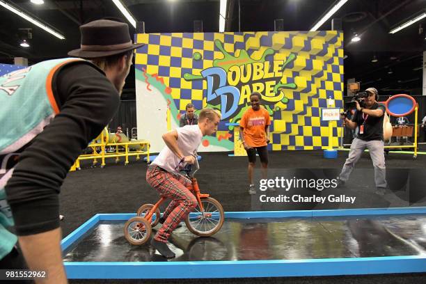 Youtube personality Josh Killacky experiences the Double Dare obstacle course at Nickelodeon's booth at 2018 VidCon at Anaheim Convention Center on...