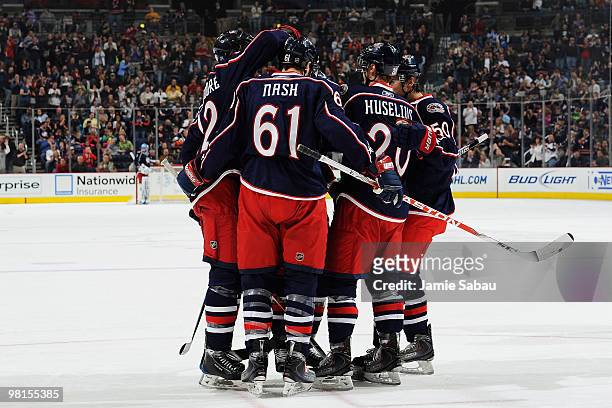 Rick Nash of the Columbus Blue Jackets is congratulated by his teammates after scoring a goal against the Tampa Bay Lightning during the first period...