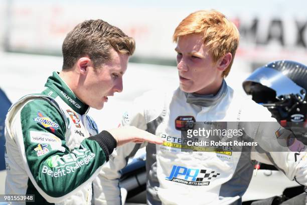 Will Rodgers, driver of the Kelly & Associates Insurance Group Ford, speaks with Cole Keatts, driver of the Peters & Keatts Equipment Ford, during...