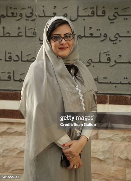 We're a nation in transit" said lawyer and businesswoman Sofana Dahlan, as she stands next to an inscription in Aabic in which Adam asks Allah for...