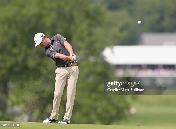 Zach Johnson watches his second shot on the second hole during the second round of the Travelers Championship at TPC River Highlands on June 22, 2018...