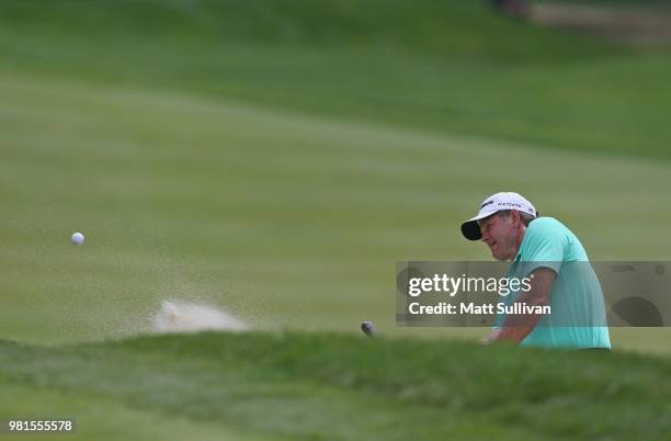 Retief Goosen of South Africa hits from the sand on the fourth hole during the second round of the Travelers Championship at TPC River Highlands on...