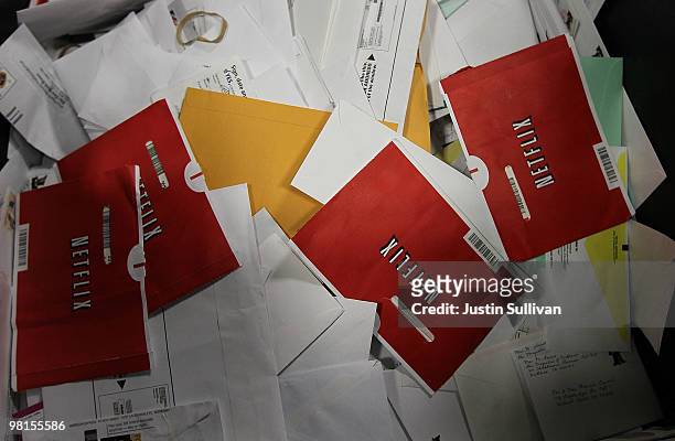 Red Netflix envelopes sit in a bin of mail at the U.S. Post Office sort center March 30, 2010 in San Francisco, California. If the U.S. Postal...
