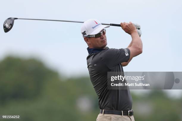 Zach Johnson watches his tee shot on the third hole during the second round of the Travelers Championship at TPC River Highlands on June 22, 2018 in...