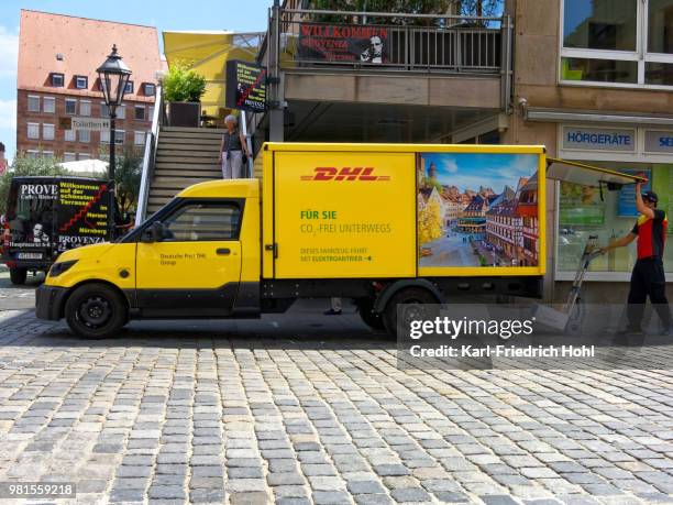 electric deutsche post vehicle - streetscooter - karl friedrich stock pictures, royalty-free photos & images