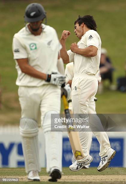 Mitchell Johnson of Australia celebrates his dismissal of Brent Arnel of New Zealand during day five of the Second Test match between New Zealand and...