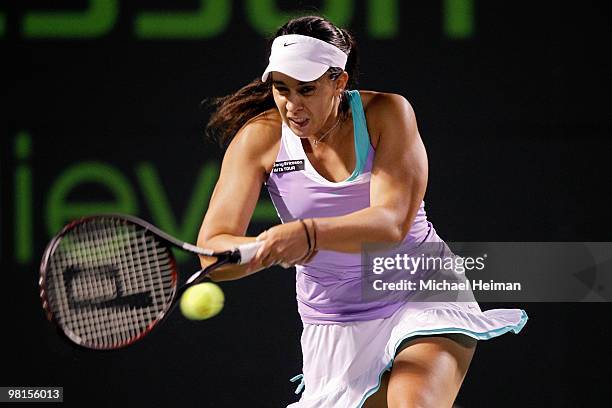 Marion Bartoli of France returns a shot against Yanina Wickmayer of Belgium during day eight of the 2010 Sony Ericsson Open at Crandon Park Tennis...