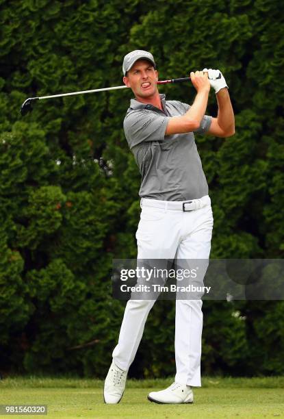 Webb Simpson of the United States plays his shot from the ninth tee during the second round of the Travelers Championship at TPC River Highlands on...