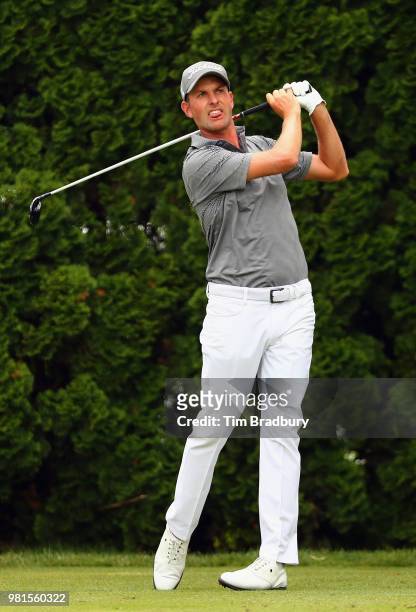 Webb Simpson of the United States plays his shot from the ninth tee during the second round of the Travelers Championship at TPC River Highlands on...