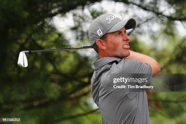 Webb Simpson of the United States plays his shot from the eighth tee during the second round of the Travelers Championship at TPC River Highlands on...