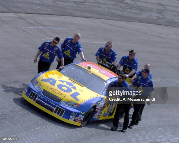 Johnny Sauter's crew pushes his car to the starting grid Sunday, April 18, 2004 in the NASCAR Advance Auto Parts 500 at Martinsville Speedway.