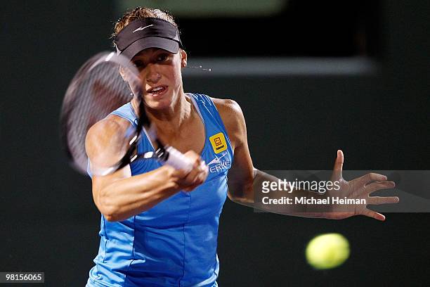 Yanina Wickmayer of Belgium returns a shot against Marion Bartoli of France during day eight of the 2010 Sony Ericsson Open at Crandon Park Tennis...