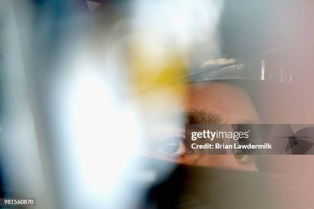 Jimmie Johnson, driver of the Lowe's for Pros Chevrolet, sits in his car during practice for the Monster Energy NASCAR Cup Series Toyota/Save Mart...