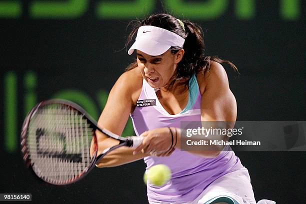 Marion Bartoli of France returns a shot against Yanina Wickmayer of Belgium during day eight of the 2010 Sony Ericsson Open at Crandon Park Tennis...