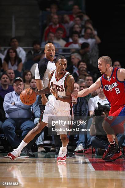 Brandon Jennings of the Milwaukee Bucks dribbles against Steve Blake of the Los Angeles Clippers on March 30, 2010 at the Bradley Center in...