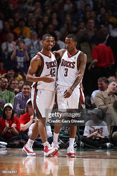 Brandon Jennings congratulates teammate Charlie Bell of teh Milwaukee Bucks following a made shot against the Los Angeles Clippers on March 30, 2010...
