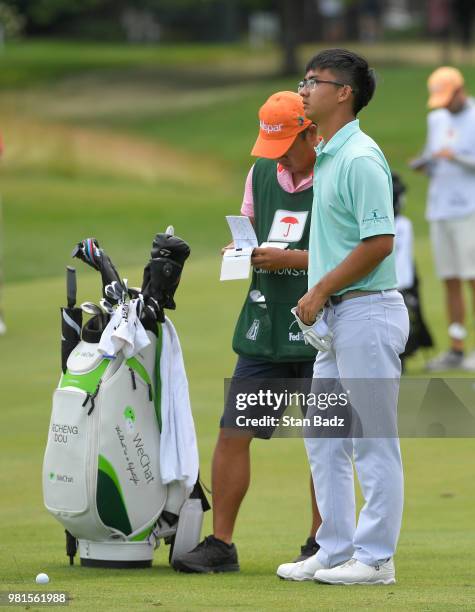 Zecheng Dou of China plays a shot oon the ninth hole during the second round of the Travelers Championship at TPC River Highlands on June 22, 2018 in...