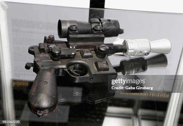 Movie prop of a BlasTech DL-44 blaster used by the character Han Solo in the movie "Return of the Jedi" is displayed during a preview for Julien's...