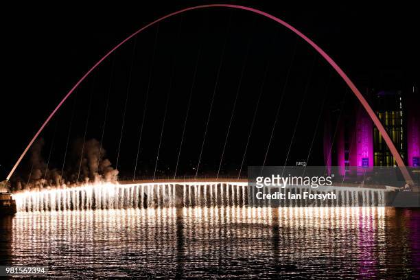 Firework waterfall cascades from the Millenium Bridge on the River Tyne during the opening ceremony of the Great Exhibition of the North on June 22,...